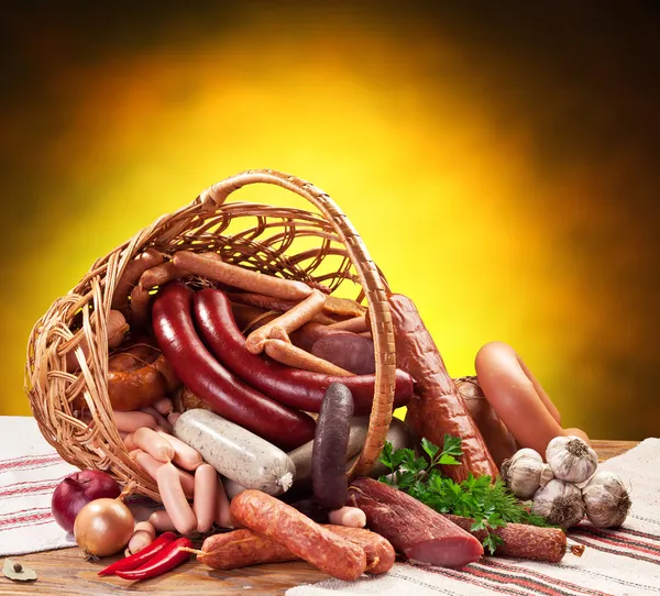 Variety of sausage products in the basket. — Stock Photo, Image