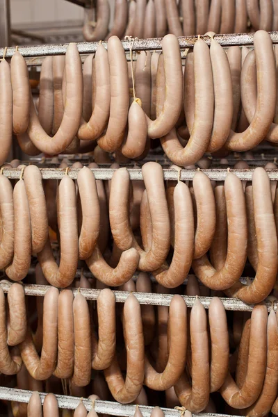 Sausage products at the cooler storage. — Stock Photo, Image