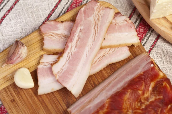 Gammon of bacon on the cutting board. — Stock Photo, Image