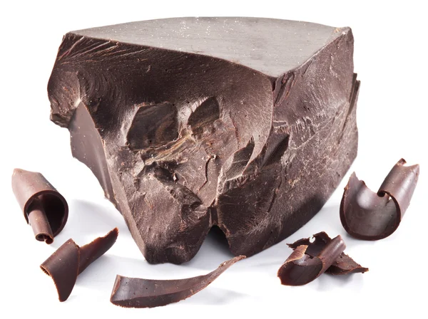 Chocolate block and chips near it. — Stock Photo, Image