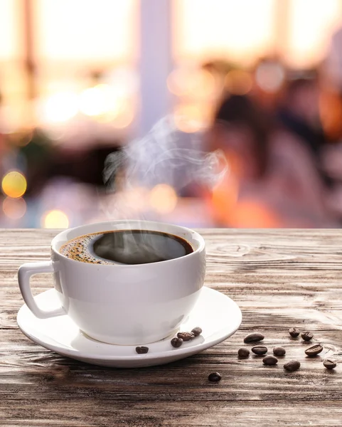 Cup of hot coffee on a old wooden table. — Stock Photo, Image