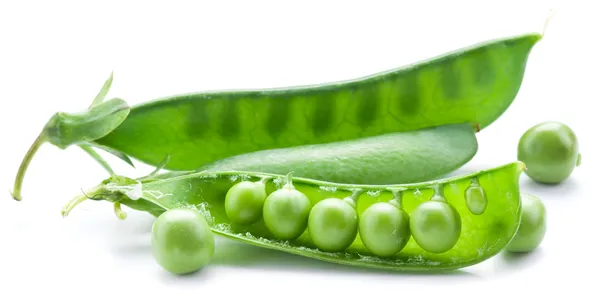 Fresh peas are contained within a pod. — Stock Photo, Image