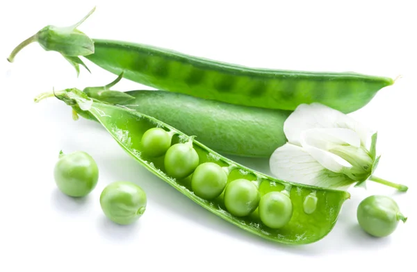 Fresh peas are contained within a pod. — Stock Photo, Image