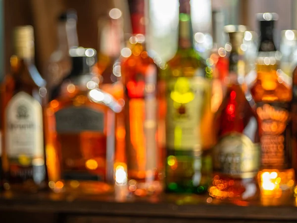 Beautiful Bokeh Row Alcoholic Bottles Backlight — Stock Photo, Image
