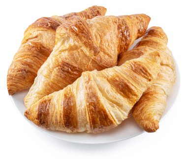 Beyaz arka planda tabakta lezzetli kruvasanlar. Dosya kırpma yolu içeriyor.