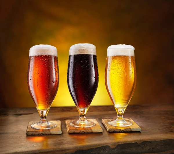 Cooled Glasses Three Different Beer Condensate Drops Wooden Table Brown — Stock Photo, Image