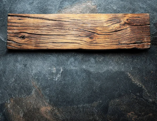 Vieja Tabla Madera Sobre Fondo Piedra Vista Superior — Foto de Stock