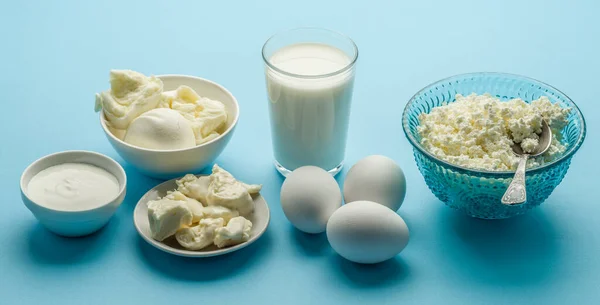 Different Dairy Product Eggs Blue Background — Stock fotografie