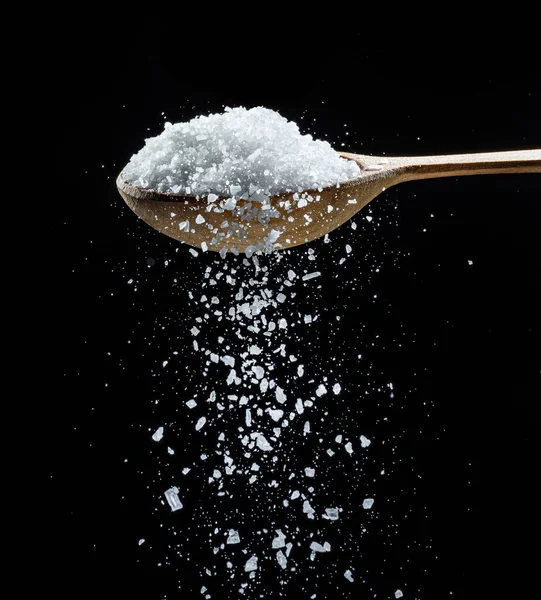 Edible Salt Crystals Falling Wooden Spoon Black Background — Stock Photo, Image