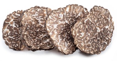 Black winter truffle slices on white background. The most famous of the trufflez. clipart