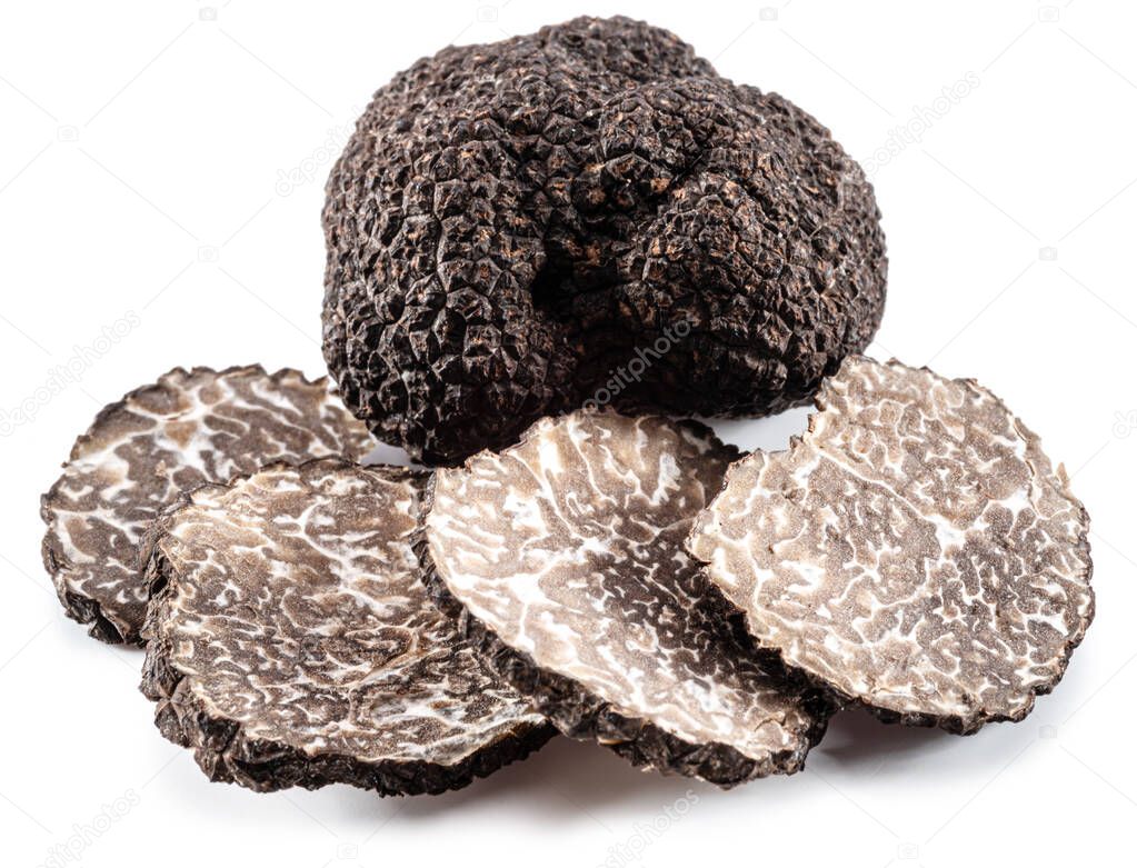 Black winter truffle and truffle slices on white background. The most famous of the trufflez.