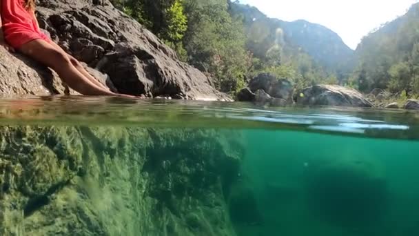 Half Underwater View Beautiful Mountain River Girl Swinging Her Legs — Video