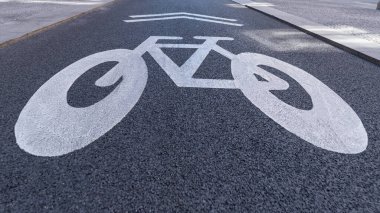 Traffic sign for informing cyclists on the cycle path painted in white on the asphalt