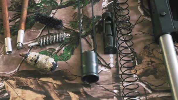 Disassembled Shotgun Cleaning Kit Camouflage Background — Stock Video