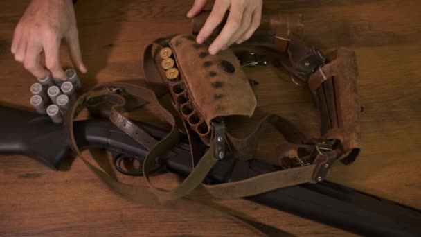 Man Preparing Hunting Fills Bandolier Gauge Cartridges Black Shotgun Table — Vídeo de Stock
