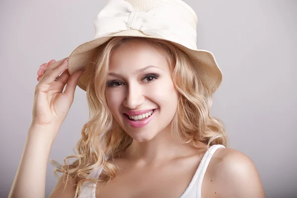 Beautiful young girl in a hat — Stock Photo, Image