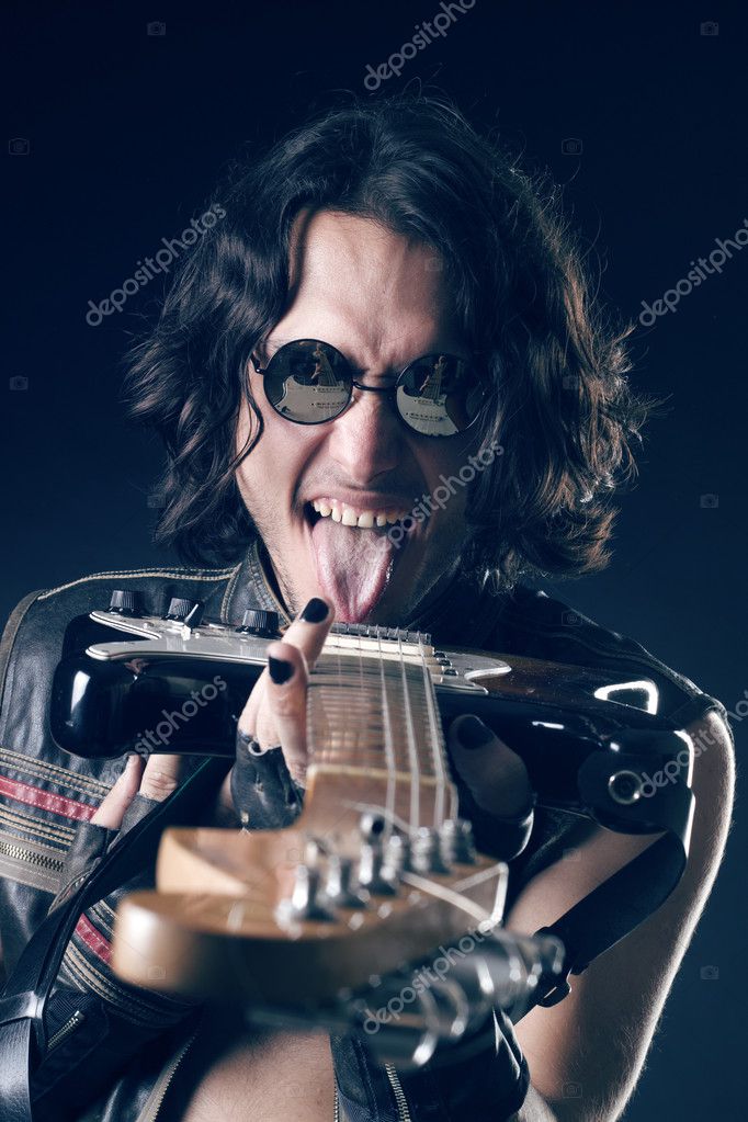 Rocker with electric guitar Stock Photo by ©DmitryPoch 150945612