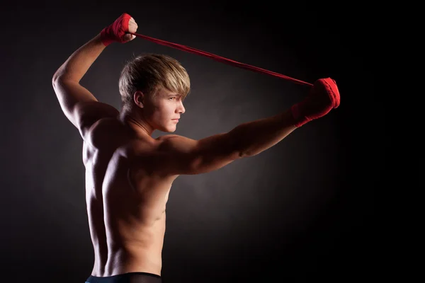 Muscular young sexy nude man on studio — Stock Photo, Image