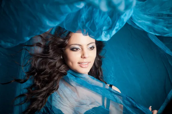 Portrait of young girl dancing with long textile — Stock Photo, Image