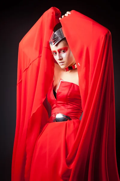 Sexy woman in fluttering red dress — Stock Photo, Image