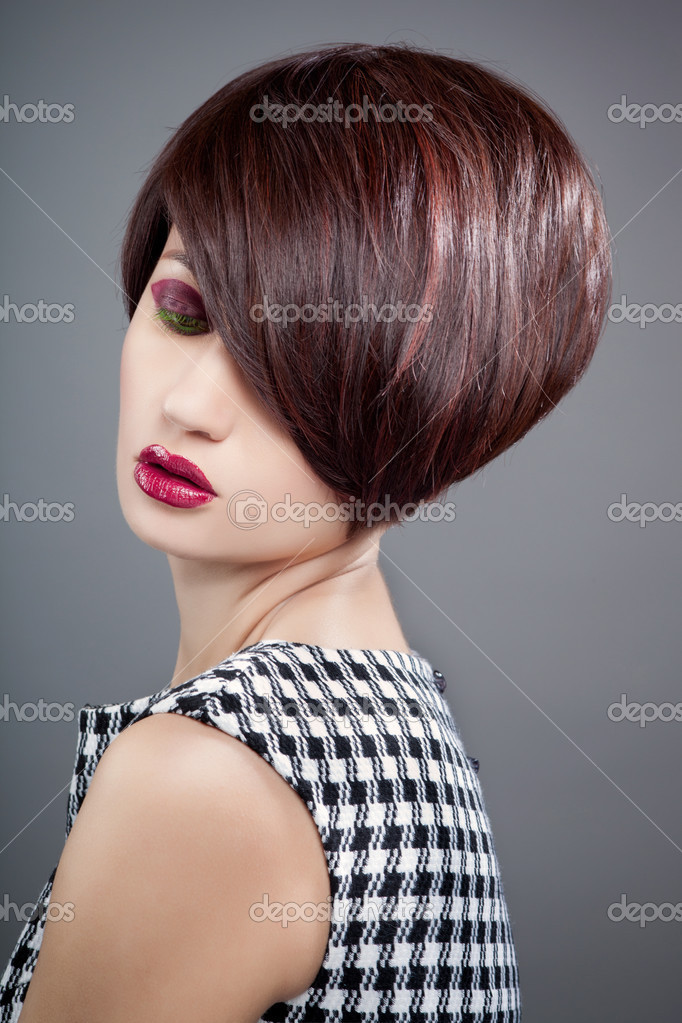 Retrato De Una Mujer Joven Y Bella Sobre Fondo Gris Foto De Stock C Margo Black 23511115