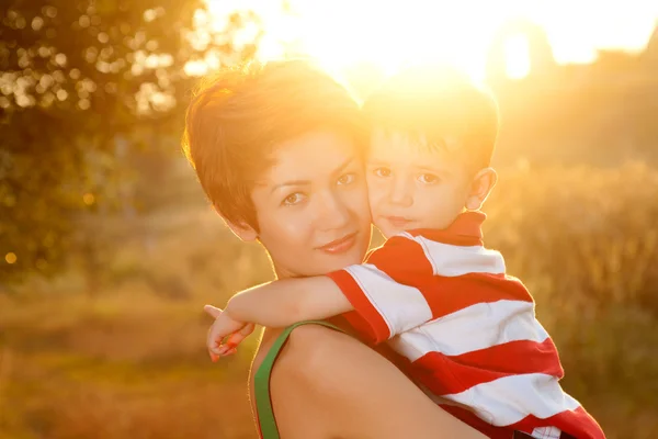 Happy little boy in the park with mother — Stock Photo, Image