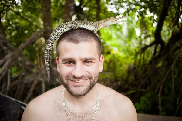 Guy with the crocodiles in the jungle, closeup shot — Stock Photo, Image