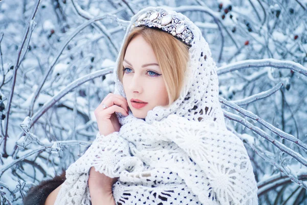 Beauty woman in winter forest