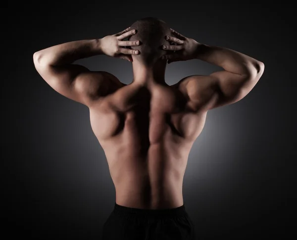 Muscular young sexy nude man on studio — Stock Photo, Image