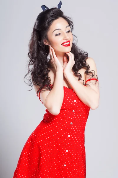 Sexy pin up girl in red dress, isolated on white — Stock Photo, Image