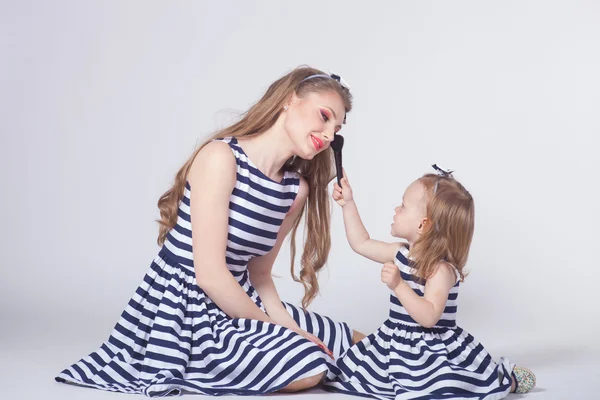 Young mother playing with daughter — Stock Photo, Image