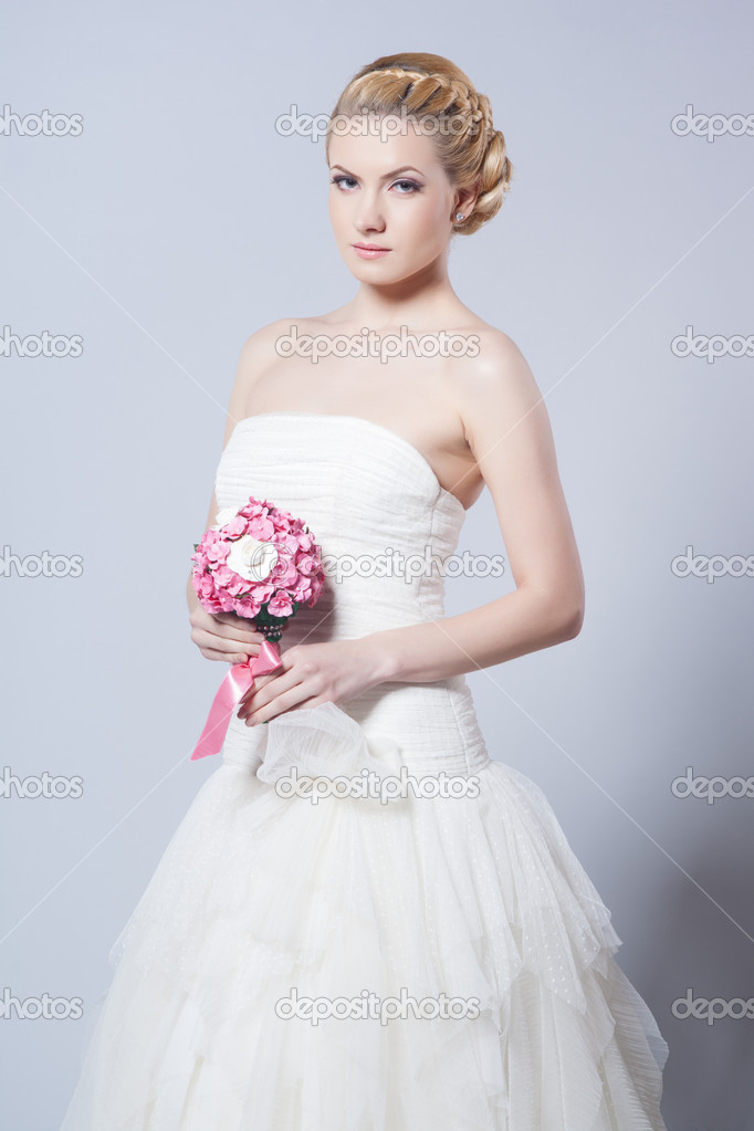 Beautiful bride with fashion hairstyle and make-up