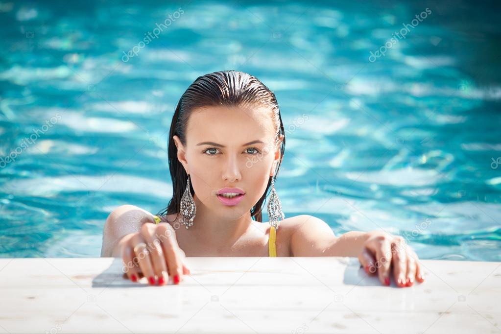 Fashion portrait of beautiful and sexy women in pool