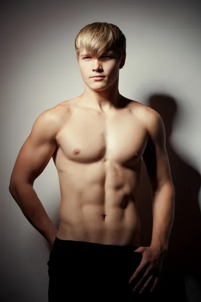 Muscular young sexy nude man on studio Stock Photo by ©margo_black 48742055