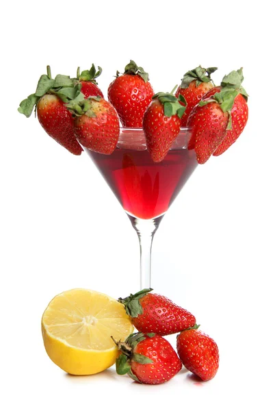 Strawberries and lemon in glass — Stock Photo, Image