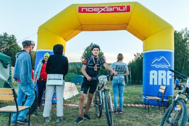 May 26-27, 2018 Naliboki,Belarus All-Belarusian amateur marathon Naliboki An athlete with a bicycle stands at the finish line