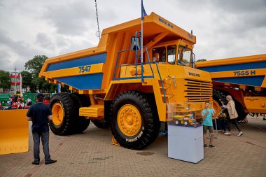 Minsk, Belarus - 3 July 2020: tourists walks near construction equipment at exhibition on street