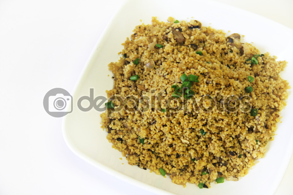 Couscous mushrooms and onions in bowl
