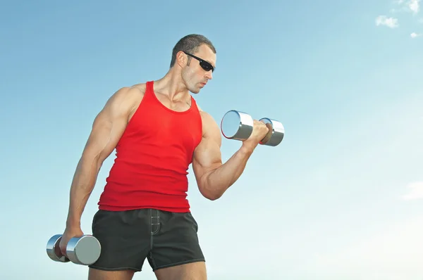 Man with dumbbells Stock Picture