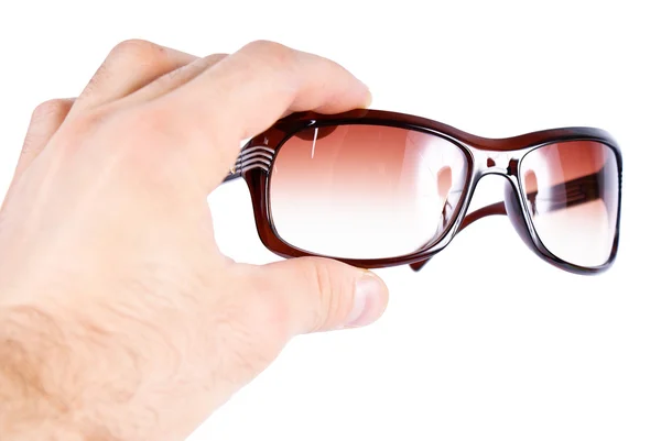 Glasses in a human hand — Stock Photo, Image