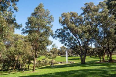 PERTH, AUSTRALIA - SEPTEMBER 9, 2022: The Pioneer Women's Memorial is located in the Western Australian Botanic Garden in Perth, Western Australia. It comprises a lake, a statue and a fountain.