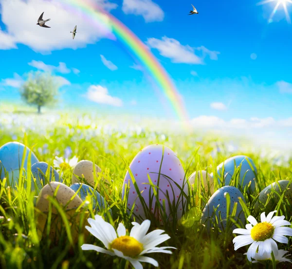 Art easter eggs on spring field — Stock Photo, Image