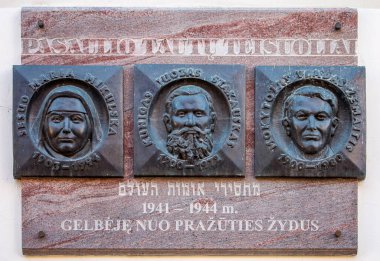 Vilnius, Lithuania - October 6, 2018: Memorial plate to Righteous among the Nations Maria Mikulska, Juozas Stakauskas and Vladas Zemaitis, who saved Jews from extermination by Nazis during the Holocaust. clipart