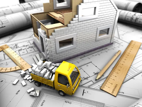 Yellow truck and model of house — Stock Photo, Image