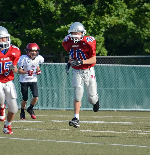 Joueur de football courir — Photo