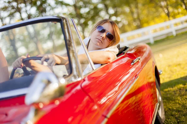 Girl in red cabriolet — Stock Photo, Image