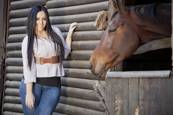 Girl in the stable — Stock Photo, Image