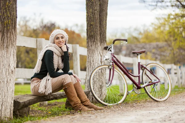 Girl with bicycle — Stock Photo, Image