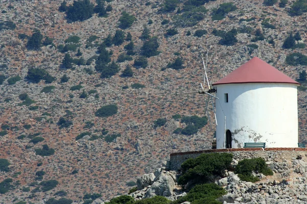 Antiguo molino de viento en la isla griega —  Fotos de Stock