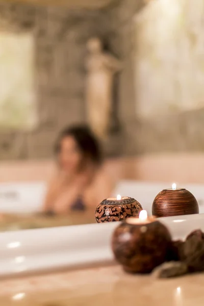 Pretty young woman relaxing in the hot tub — Stock Photo, Image